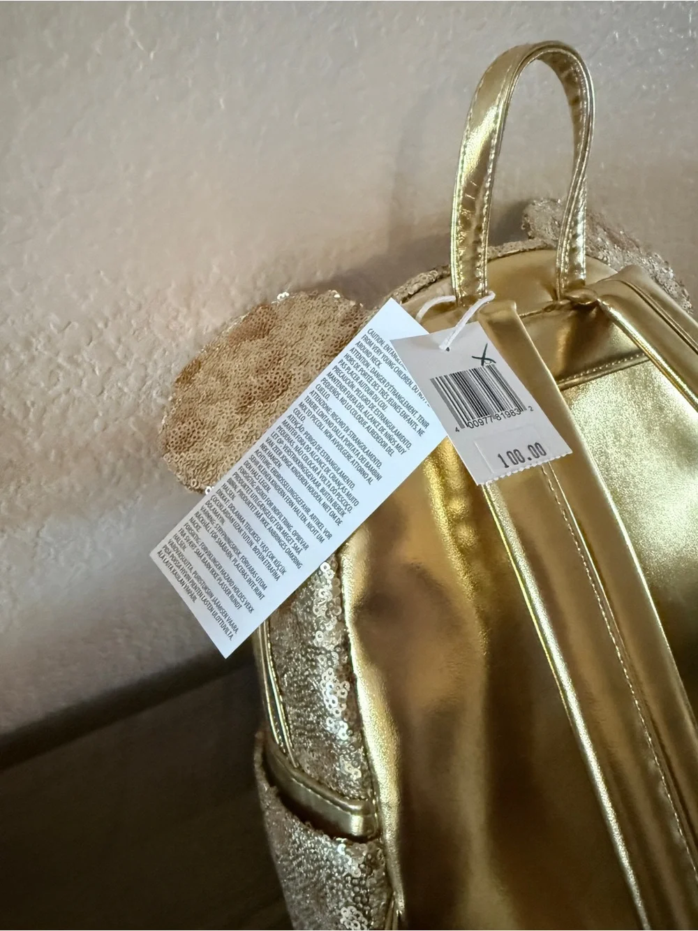 Loungefly Disney gold sequin backpack with hidden mickeys